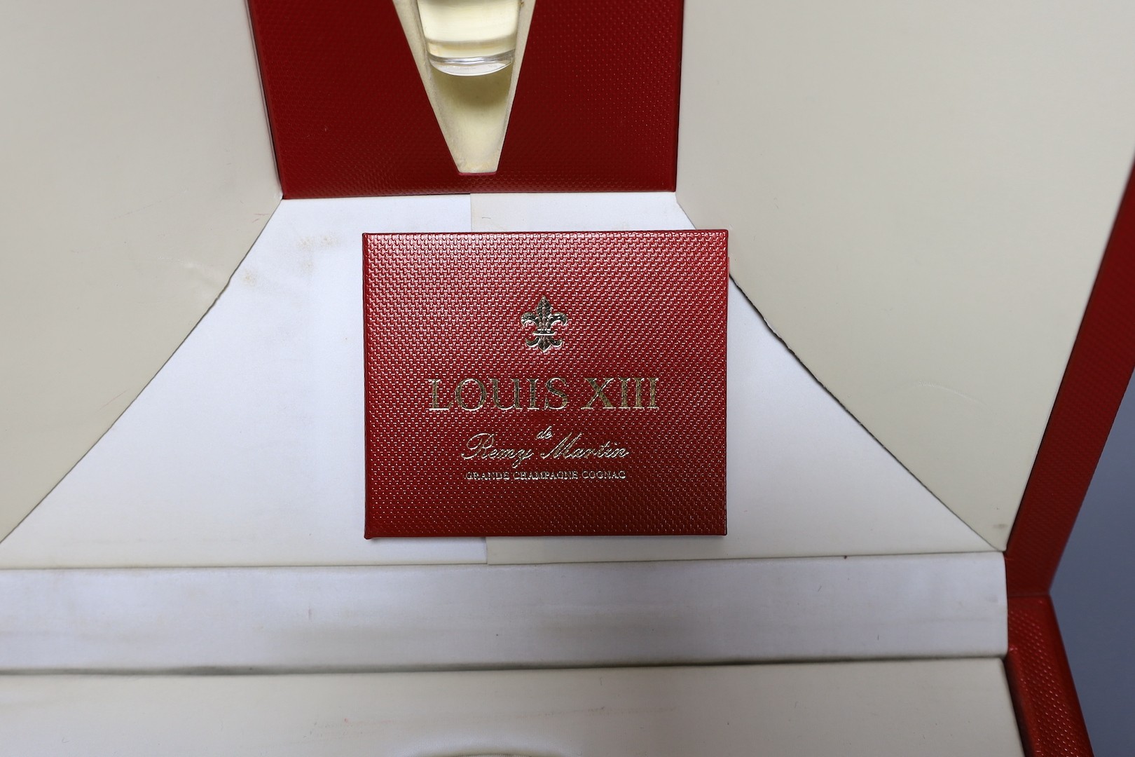 An empty bottle of Louis XIII Remy Martin Grande Champagne Cognac, carafe number DK3774 with original fitted case, stopper and box.